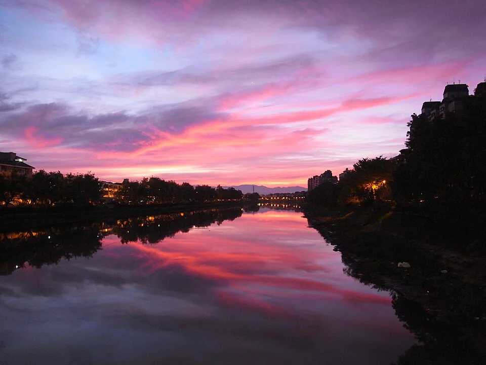 Warm morning light over a calm Red Sea lagoon with gentle ripples and soft sky gradients.