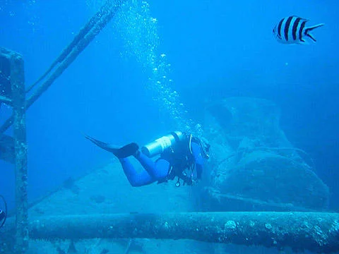 Motorbikes and crates inside the hold of the Thistlegorm wreck at approximately 30 meters near Sharm El Sheikh.