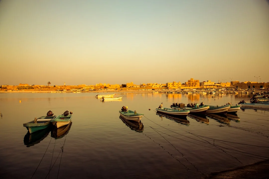 Golden light over El Gouna’s marina with yachts moored and calm lagoon waters at sunset.
