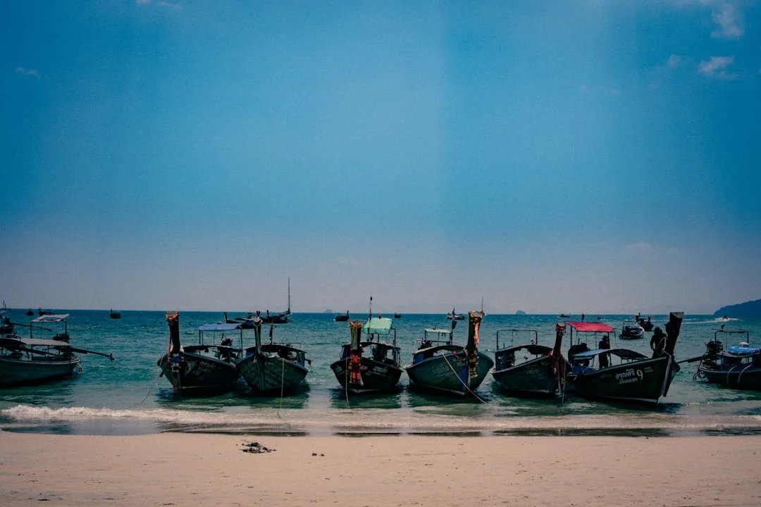 Divers exploring the cargo hold of the SS Thistlegorm wreck, showing the famous BSA motorcycles.
