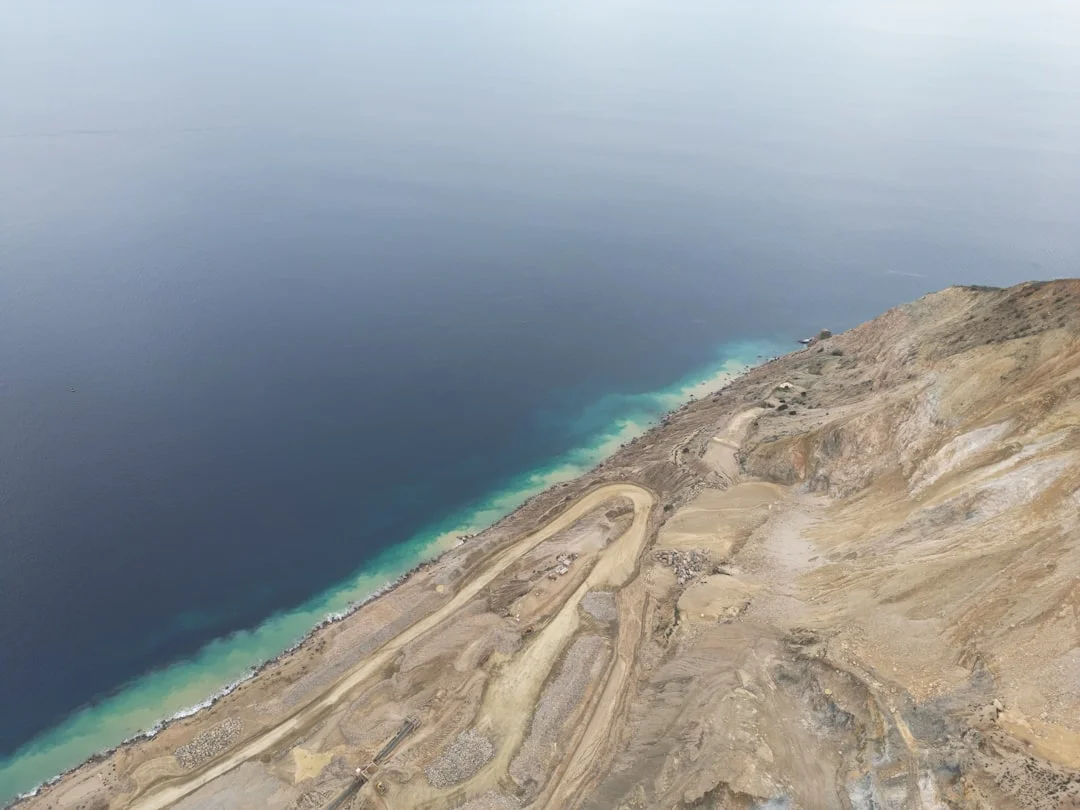 Aerial view of Sharm El Sheikh’s curved bays and reef-fringed shoreline with boats moored in calm turquoise water