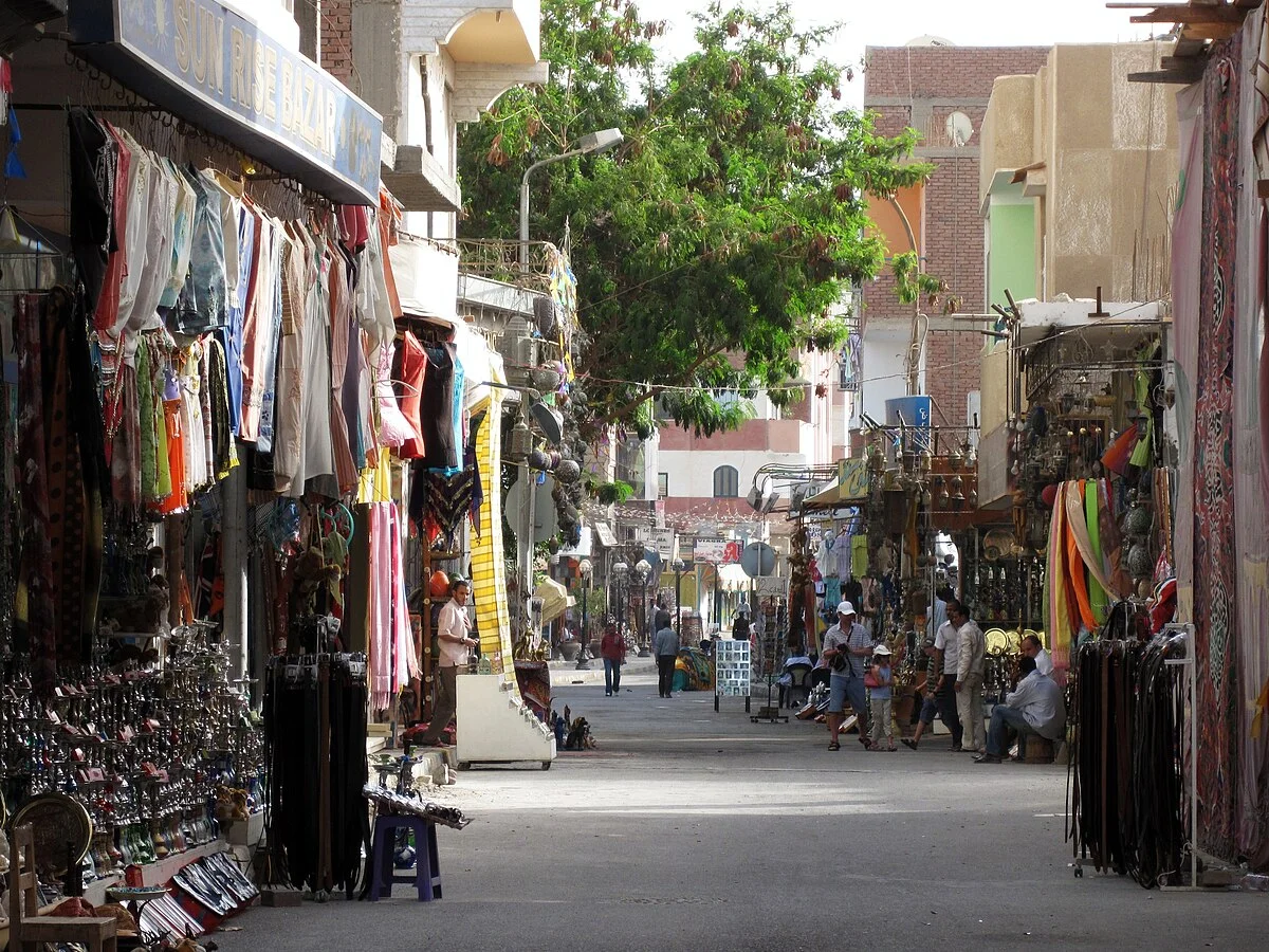 Street market scene in Hurghada with stalls and pedestrians