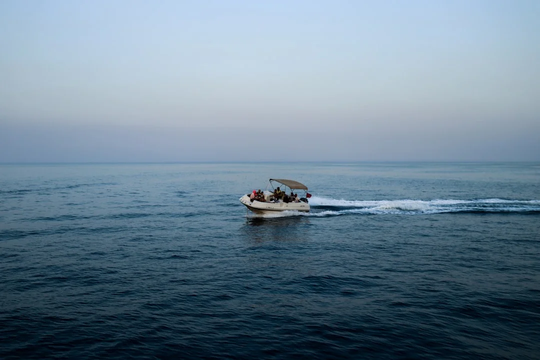 Snorkelers entering the water from a day boat above Giftun reef near Hurghada exploring Red Sea water attractions