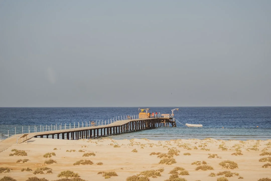 Evening walk planning stop on a Sharm El Sheikh itinerary around Naama Bay with shops and pickup points